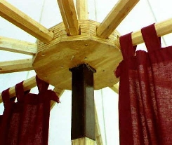 Photograph of spokes, hub, and curtains hanging from
two of the spokes